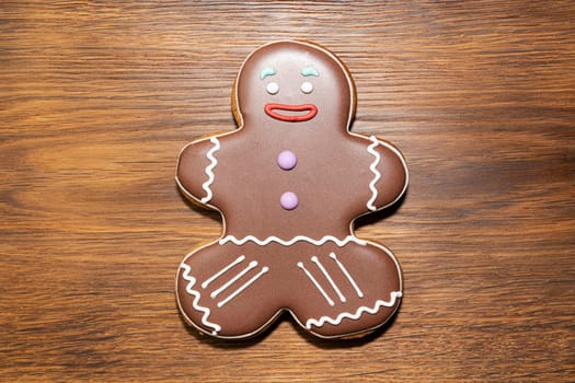 ginger cookies in the form of a man on a wooden background. High quality photo