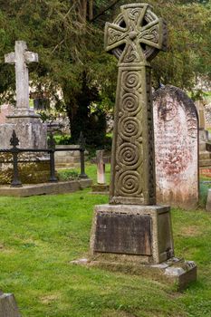 Detail of carved stone grave in a cemetery