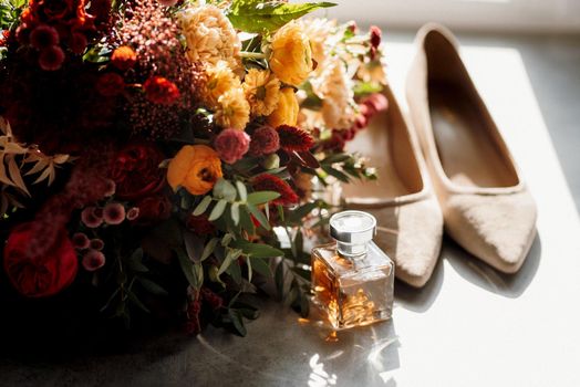 red elegant wedding bouquet of fresh natural flowers and greenery