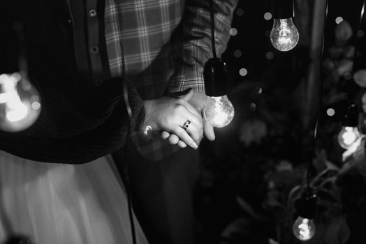 the bride and groom tenderly hold hands between them love and relationships