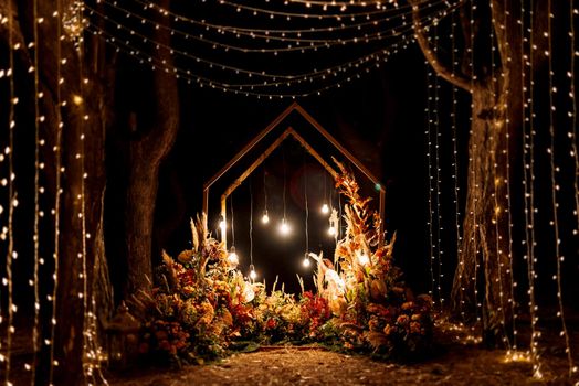 wedding ceremony area with dried flowers in a meadow in a pine brown forest