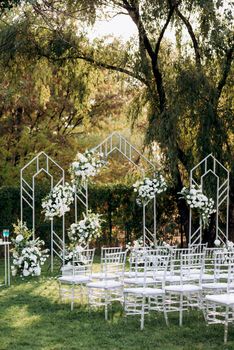 wedding ceremony area with dried flowers in a meadow in a pine brown forest