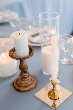 atmospheric candle decor with live fire on the banquet table