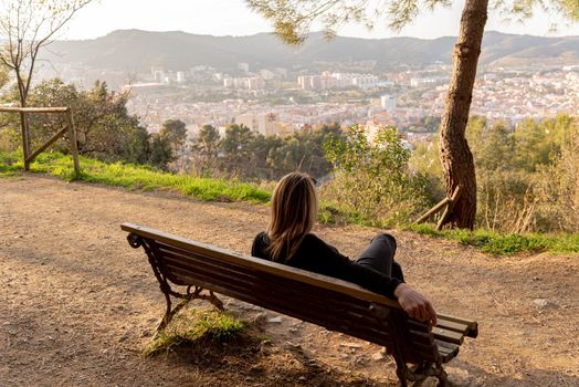 Blonde woman in El Carmel bunkers viewpoint  in Barcelona, Spain.