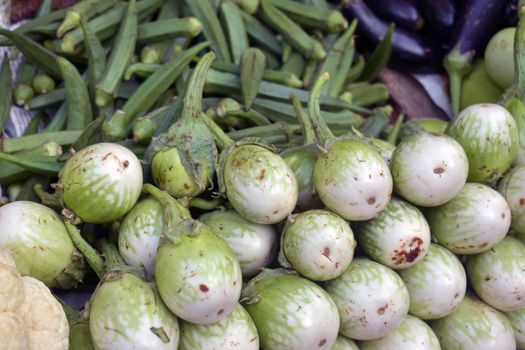 A closeup shot of green eggplants in a market place, Eggplant is a popular agricultural product in Thailand. Eggplant is used as an ingredient in many curries