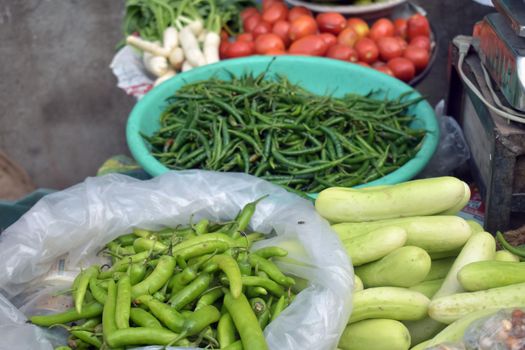 A closeup shot of assorted vegetable displayed in a market place