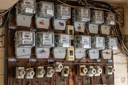 Bangkok, Thailand - Jun 19, 2020 : Watthour meter of electricity for use in home appliance.This is a modern technology that can monitor the old apartment room,  Electrical energy consumption.Electric control transformer. Electricity meter.
