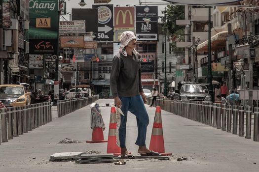 Bangkok, Thailand - Jun 19, 2020 : Labor is working on street reconstruction on Khaosan road.