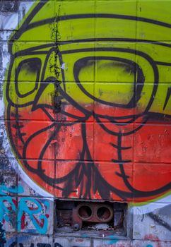 Bangkok, Thailand - Jun 19, 2020 : Graffiti on wall. Abstract creative drawings of fashionable colors on the walls of the city. Urban contemporary culture. Abstract stylish drawing.