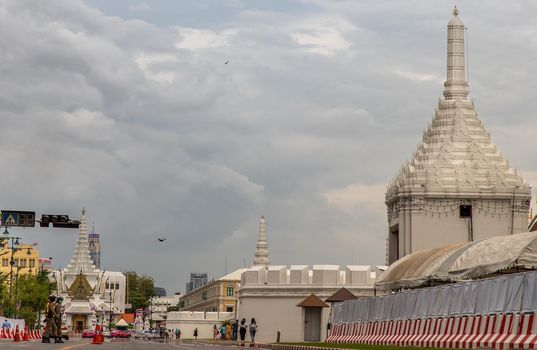 Bangkok, Thailand - Jun 19, 2020 : The road in front of Wat Phra Kaew (Temple of Emerald Buddha) and Grand Palace With a long white wall. And with the background of the sky in Bangkok.