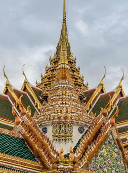 Bangkok, Thailand - Jun 19, 2020 : Beautiful Thai architecture of buildings in The Temple of the Emerald Buddha, the most sacred Buddhist temple in Thailand, it is also a potent religion symbolic of Thailand.