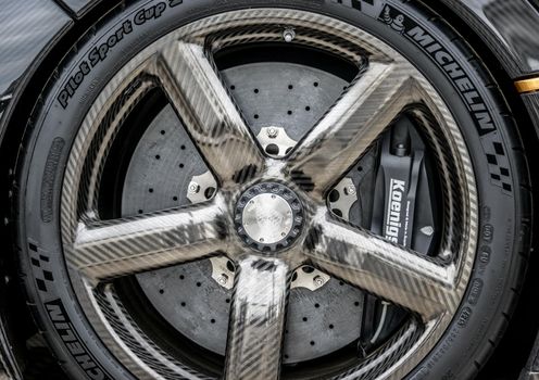 LONDON, UK - CIRCA JUNE 2014: Koenigsegg One:1 carbon fibre wheel, disk brake and Michelin tyre.