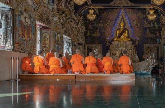 Bangkok, Thailand - Feb 08, 2020 : Buddhist Monks praying and pay respect Buddha statue at Wat Pariwas (Pariwas Temple). Evening Chant. No focus, specifically.