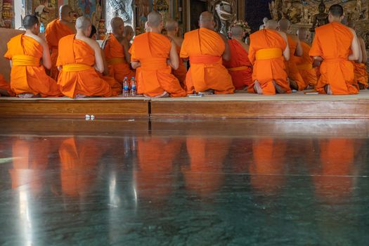 Bangkok, Thailand - Feb 08, 2020 : Buddhist Monks praying and pay respect Buddha statue at Wat Pariwas (Pariwas Temple). Evening Chant. No focus, specifically.