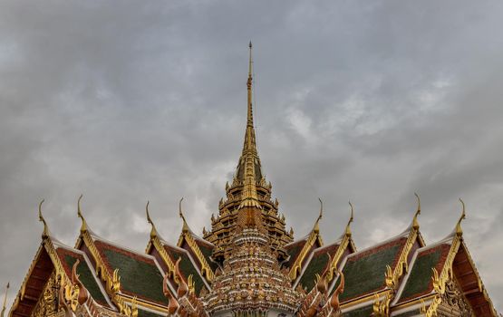 Bangkok, Thailand - Jun 19, 2020 : Beautiful Thai architecture of buildings in The Temple of the Emerald Buddha, the most sacred Buddhist temple in Thailand, it is also a potent religion symbolic of Thailand.