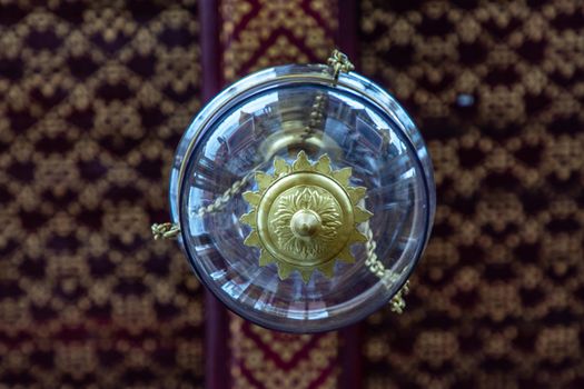 Bangkok, Thailand - Jun 19, 2020 : Beautiful lamp on the ceiling in The Temple of Emerald Buddha or Wat Phra sri rattana sasadaram.