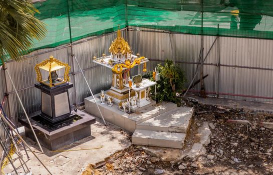 Bangkok, Thailand - Jun 19, 2020 : Thai spirit house ; shrine of the household god on Construction zone in bangkok. Joss house.