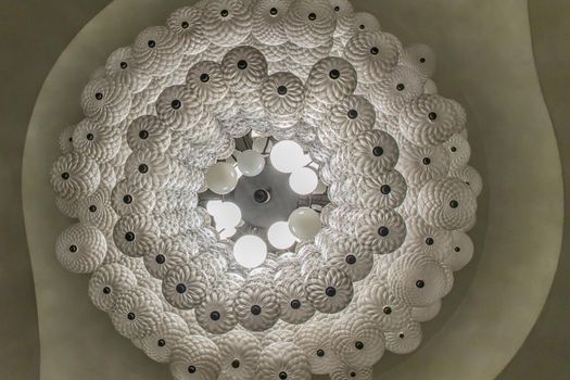 Bottom view of White gorgeous vintage chandelier decoration at Siam Square. Cultural entertainment.