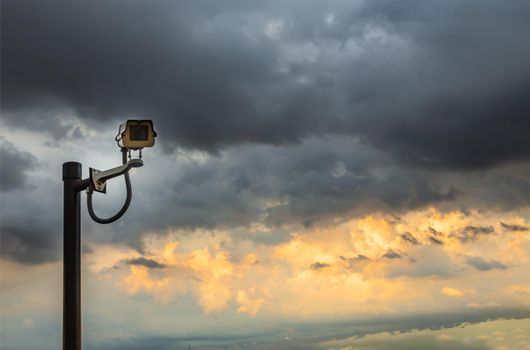 Modern surveillance camera on the sky background. the concept of surveillance and visual inspection that has been developed. copy space. Selective focus.