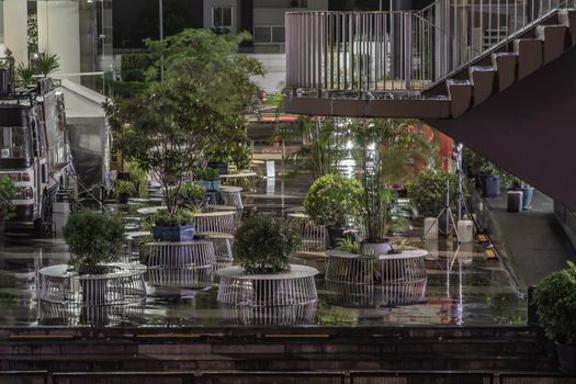 Greenery decoration of connecting area of the two malls. Selective focus.