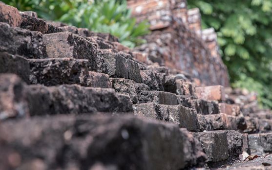 Close-up of Cracked concrete vintage brick wall background. Archaeological area. Pattern on the wall with space for text, No focus, specifically.