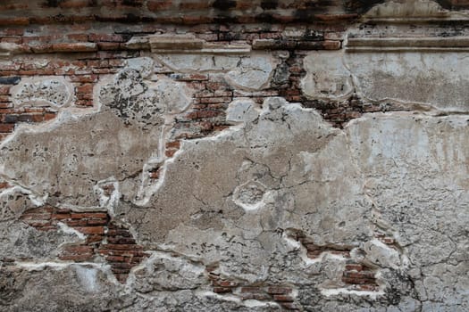 Cracked concrete vintage brick wall background. Archaeological area. Pattern on the wall with space for text, No focus, specifically.