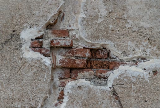 Cracked concrete vintage brick wall background. Archaeological area. Pattern on the wall with space for text, No focus, specifically.