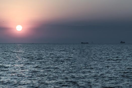 Beautiful sunset over a calm sea. Space for text, Selective focus.