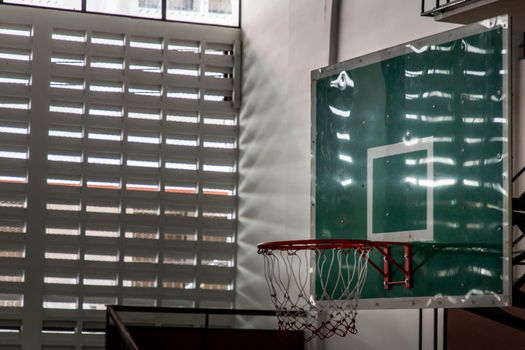 indoor sport basketball hoop in gym. Interior of a basketball hall. Copy space, Selective focus.