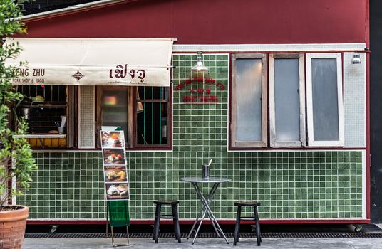 Bangkok, Thailand - Aug 01, 2020 : Exterior design and frontstore decoration of "FENG ZHU PORK SHOP & CO." Chinese retro style. Selective focus.