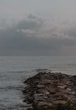 Rocks and sea : View of sea waves hitting rocks on the Calm beach in the morning. Focus and blur.