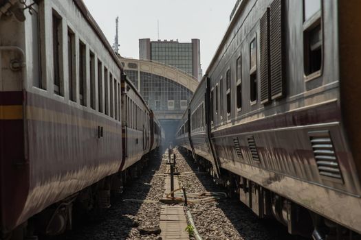 Two train is parked at platform waiting for passengers in hua lamphong railway station. the main railway station of Thailand located in the center of Bangkok. Focus and blur.