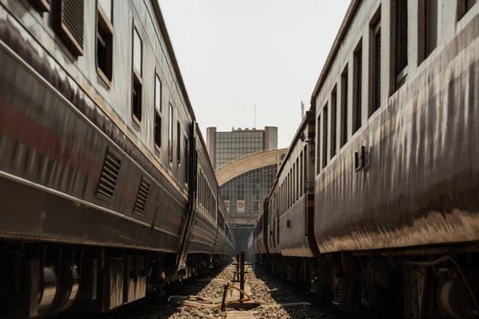 Two train is parked at platform waiting for passengers in hua lamphong railway station. the main railway station of Thailand located in the center of Bangkok. Focus and blur.