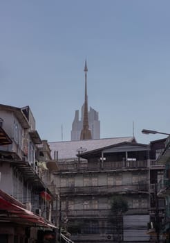 City view of Bangkok with House and Modern tall building and Thai temple that perfectly coexist. No focus, specifically.