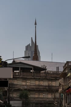 City view of Bangkok with House and Modern tall building and Thai temple that perfectly coexist. No focus, specifically.