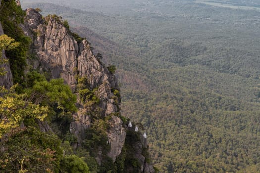 Lampang, Thailand - Sep 03, 2020 : Pagoda on top of the cliff high mountain at Chaloem Phrakiat Phrachomklao Rachanuson temple (Wat Phrabat Pu Pha Daeng) Chae-Hom District, Lampang province, Unseen and Amazing temple in Thailand. Selective focus.