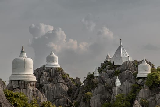 Lampang, Thailand - Sep 03, 2020 : Pagoda on top of the cliff high mountain at Chaloem Phrakiat Phrachomklao Rachanuson temple (Wat Phrabat Pu Pha Daeng) Chae-Hom District, Lampang province, Unseen and Amazing temple in Thailand. Selective focus.