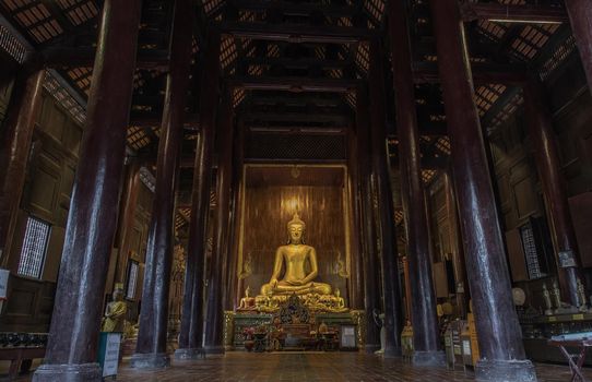 Chiangmai, Thailand - Sep 07, 2020 : The buddha image in main vihan at wat phun tao. Wat phan tao is a beautiful wooden temple in chiang mai. Selective focus.