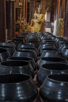 Chiangmai, Thailand - Sep 07, 2020 : The buddha image and 
monk's alms bowl in main vihan at wat phun tao. Selective focus.