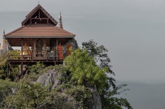 Lampang, Thailand - Sep 03, 2020 : Pagoda on top of the cliff high mountain at Chaloem Phrakiat Phrachomklao Rachanuson temple (Wat Phrabat Pu Pha Daeng) Chae-Hom District, Lampang province, Unseen and Amazing temple in Thailand. Selective focus.