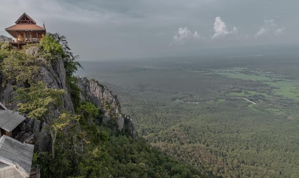 Lampang, Thailand - Sep 03, 2020 : Pagoda on top of the cliff high mountain at Chaloem Phrakiat Phrachomklao Rachanuson temple (Wat Phrabat Pu Pha Daeng) Chae-Hom District, Lampang province, Unseen and Amazing temple in Thailand. Selective focus.