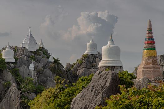 Lampang, Thailand - Sep 03, 2020 : Pagoda on top of the cliff high mountain at Chaloem Phrakiat Phrachomklao Rachanuson temple (Wat Phrabat Pu Pha Daeng) Chae-Hom District, Lampang province, Unseen and Amazing temple in Thailand. Selective focus.