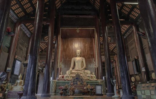Chiangmai, Thailand - Sep 07, 2020 : The buddha image in main vihan at wat phun tao. Wat phan tao is a beautiful wooden temple in chiang mai. Selective focus.