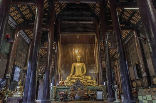 Chiangmai, Thailand - Sep 07, 2020 : The buddha image in main vihan at wat phun tao. Wat phan tao is a beautiful wooden temple in chiang mai. Selective focus.
