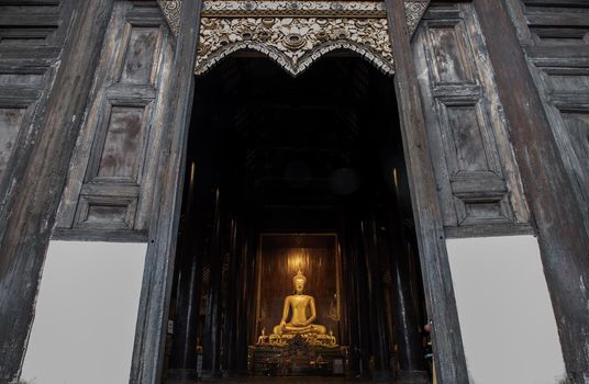 Chiangmai, Thailand - Sep 07, 2020 : The buddha image in main vihan at wat phun tao. Wat phan tao is a beautiful wooden temple in chiang mai. Selective focus.