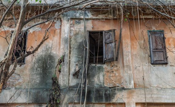 Old wooden windows on the old wall. Traditional Architecture style, Selective focus.