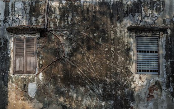 Old wooden windows on the old wall. Traditional Architecture style, Selective focus.