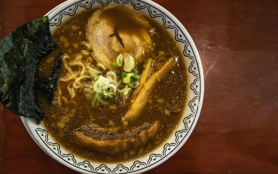 Japanese ramen soup served with chashu pork Japanese bamboo shoots Sliced ​​seaweed and scallions. Japanese food style, Copy space, Selective focus.