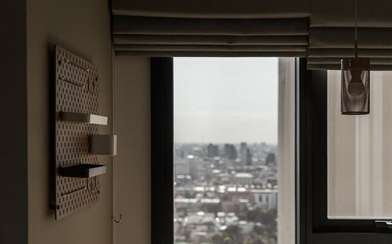 Detail of interior the living room at condominium with view city. Selective focus.