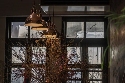 Vintage Interior design room. Decoration of old brick on the wall with vintage lamps and dried flowers. No focus, specifically.